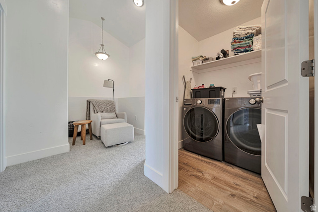 11730 South Shadow Lane Draper, UT 84020 - Photo 17 of 24 Laundry area featuring vaulted ceiling, washer and clothes dryer, and light carpet