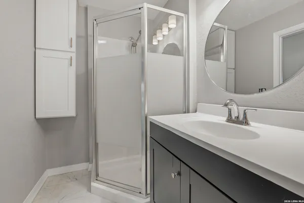 a bathroom with a sink and a mirror