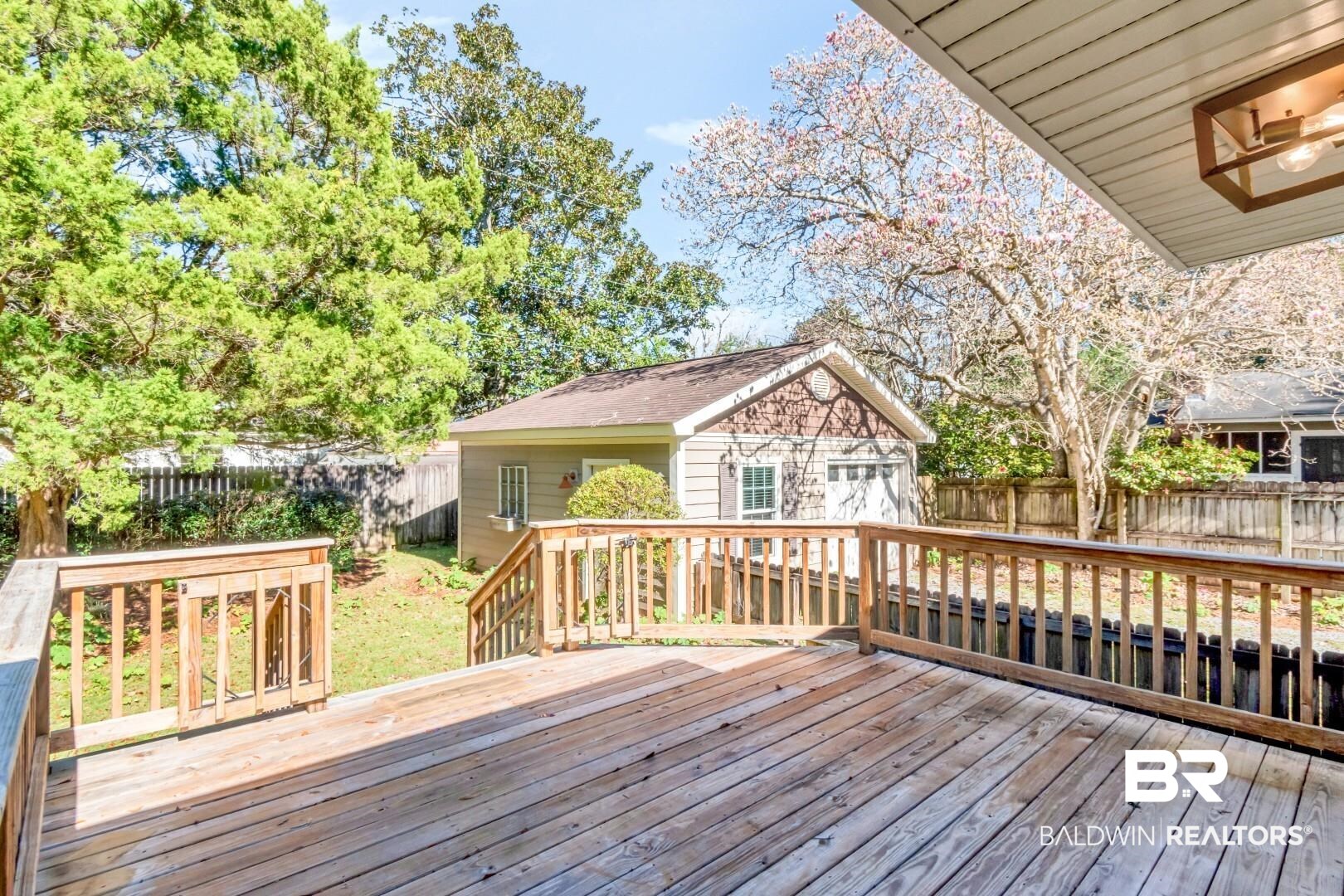 10 South Hathaway Road Mobile, AL 36608 - Photo 36 of 46 Wooden deck featuring an outbuilding and a fenced backyard