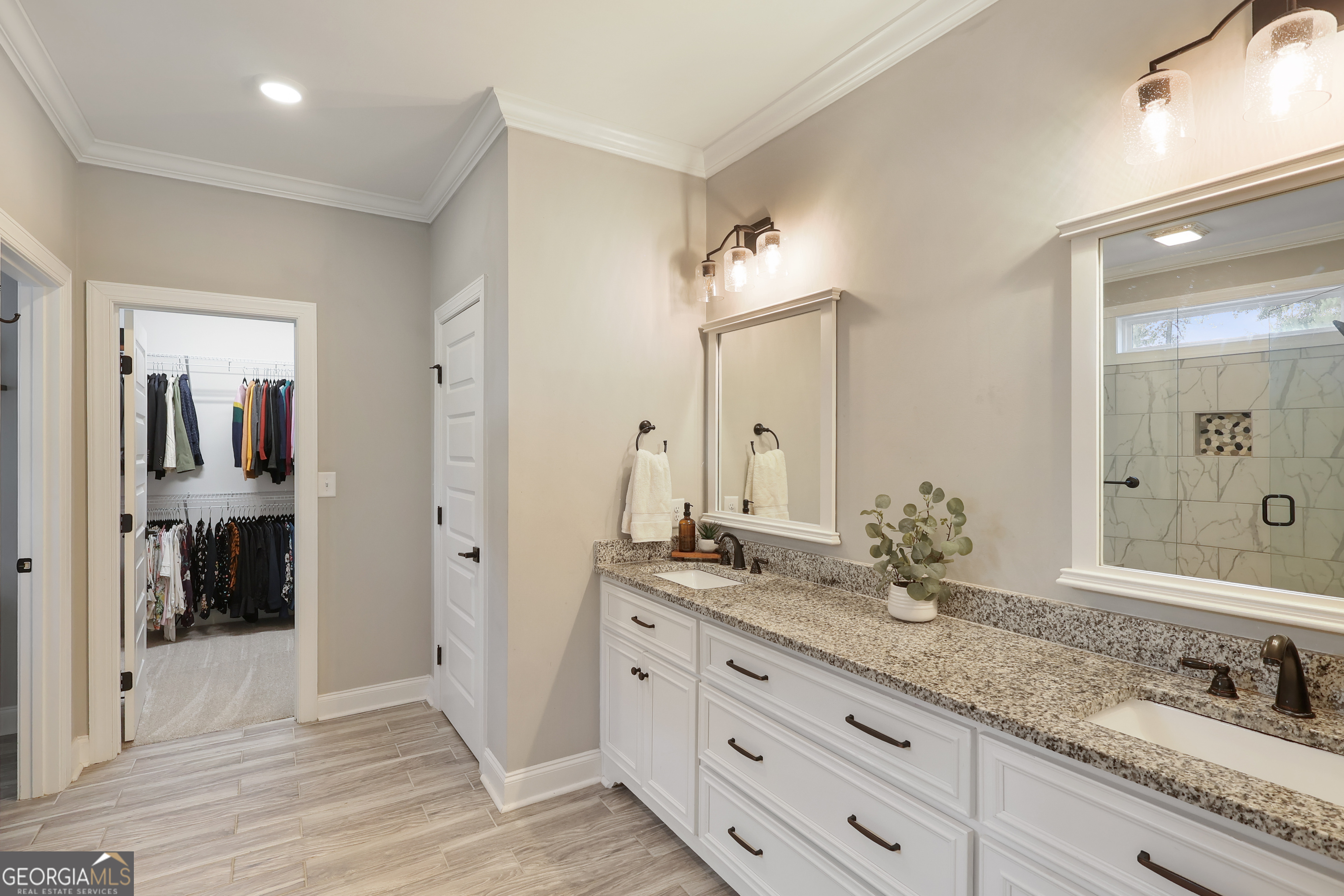 89 Claire Road Forsyth, GA 31029 - Photo 22 of 40 a bathroom with double vanity sinks and a shower