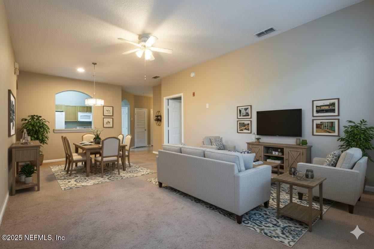 10550 Baymeadows Road, Unit 610 Jacksonville, FL 32256 - Photo 1 of 35 a living room with furniture and a flat screen tv