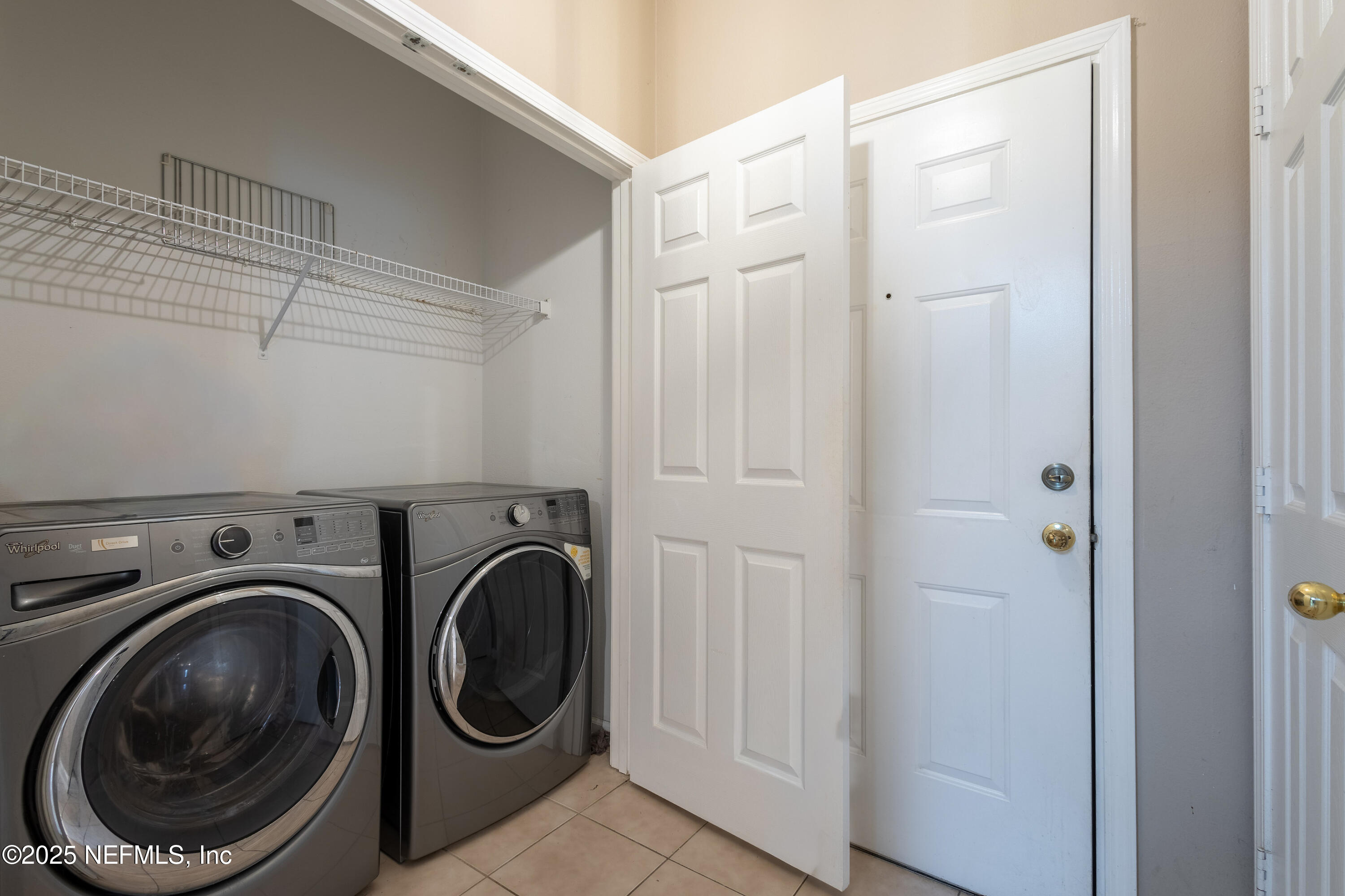 10550 Baymeadows Road, Unit 610 Jacksonville, FL 32256 - Photo 12 of 35 a utility room with dryer and washer