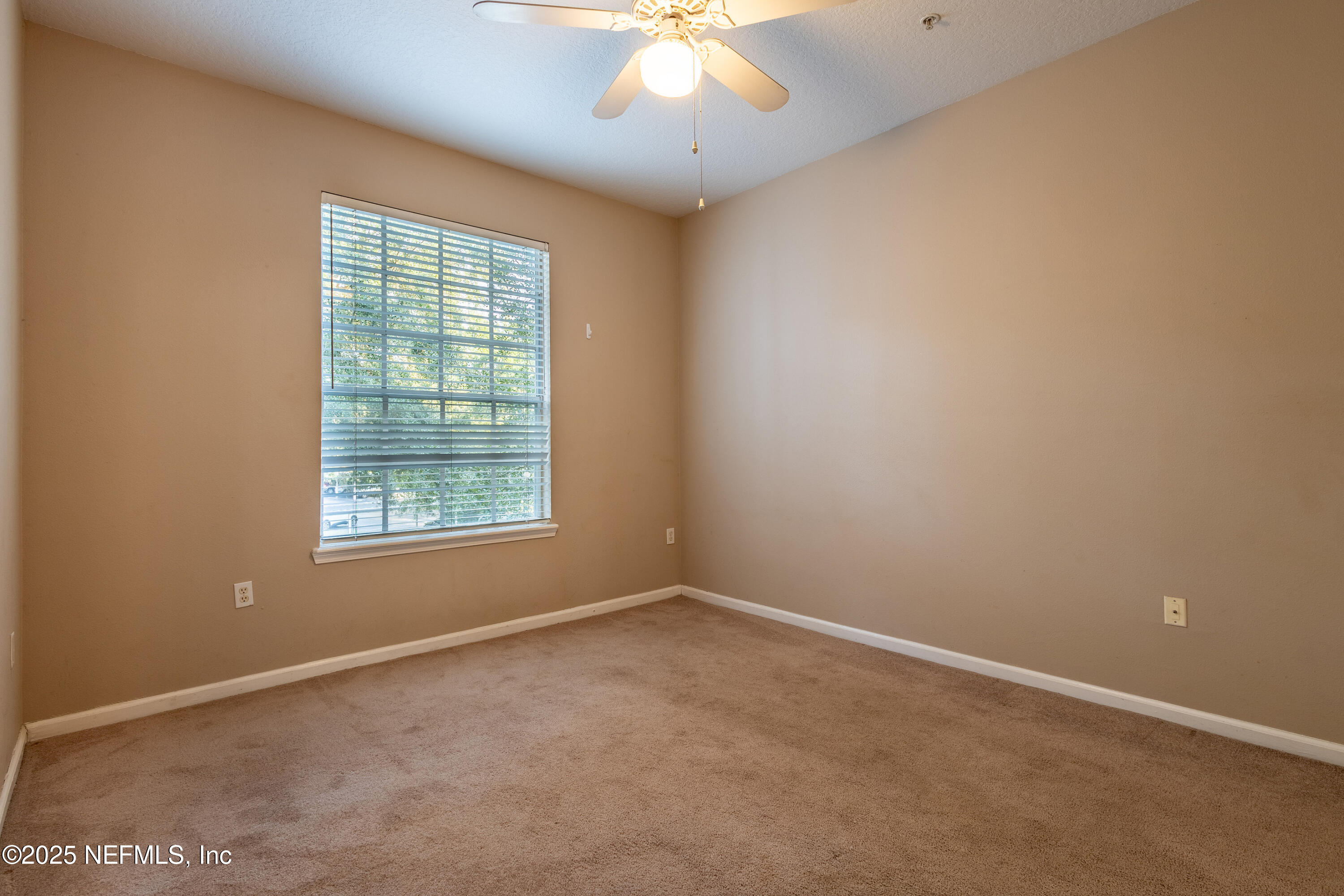 10550 Baymeadows Road, Unit 610 Jacksonville, FL 32256 - Photo 16 of 35 an empty room with a window