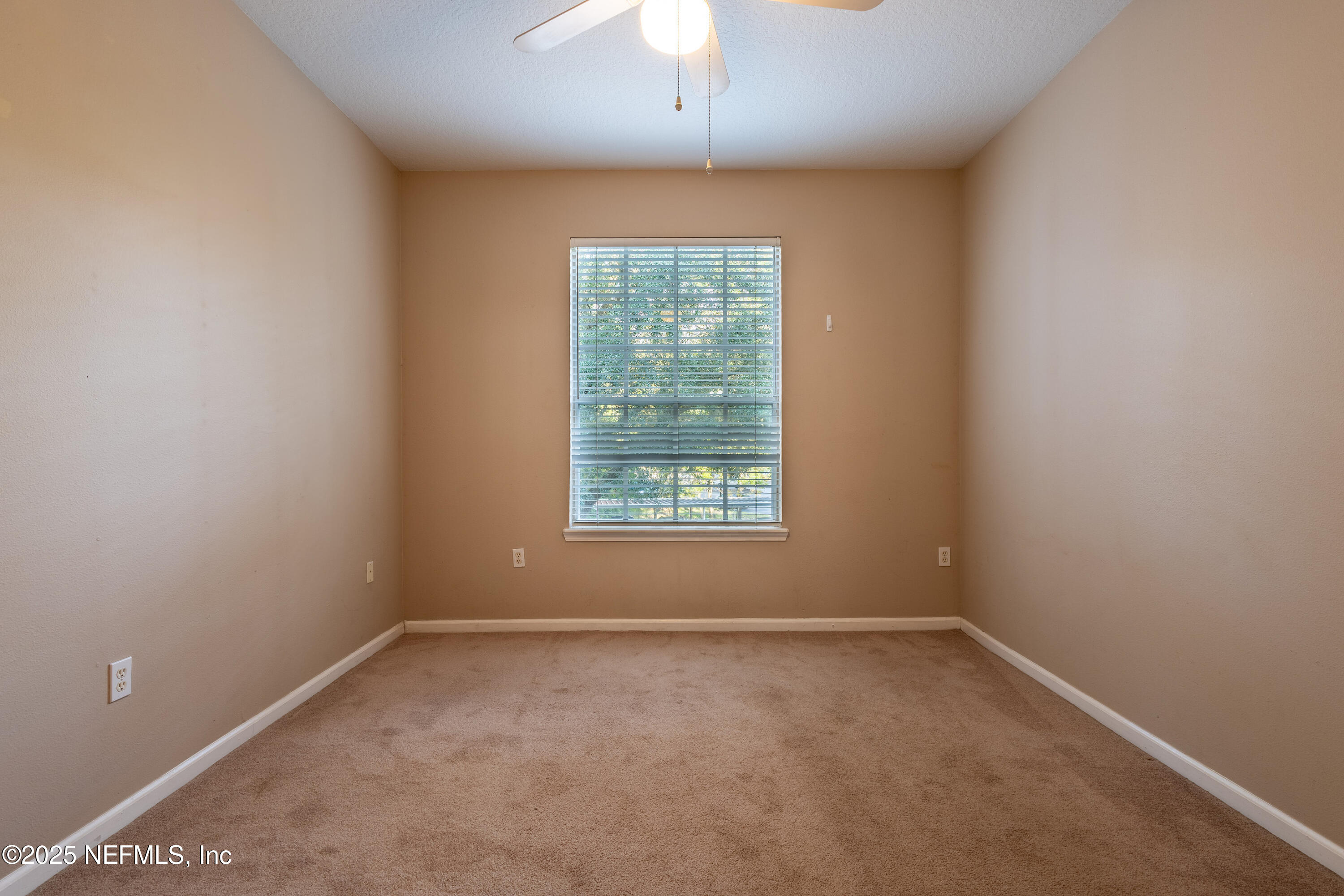 10550 Baymeadows Road, Unit 610 Jacksonville, FL 32256 - Photo 19 of 35 an empty room with a window