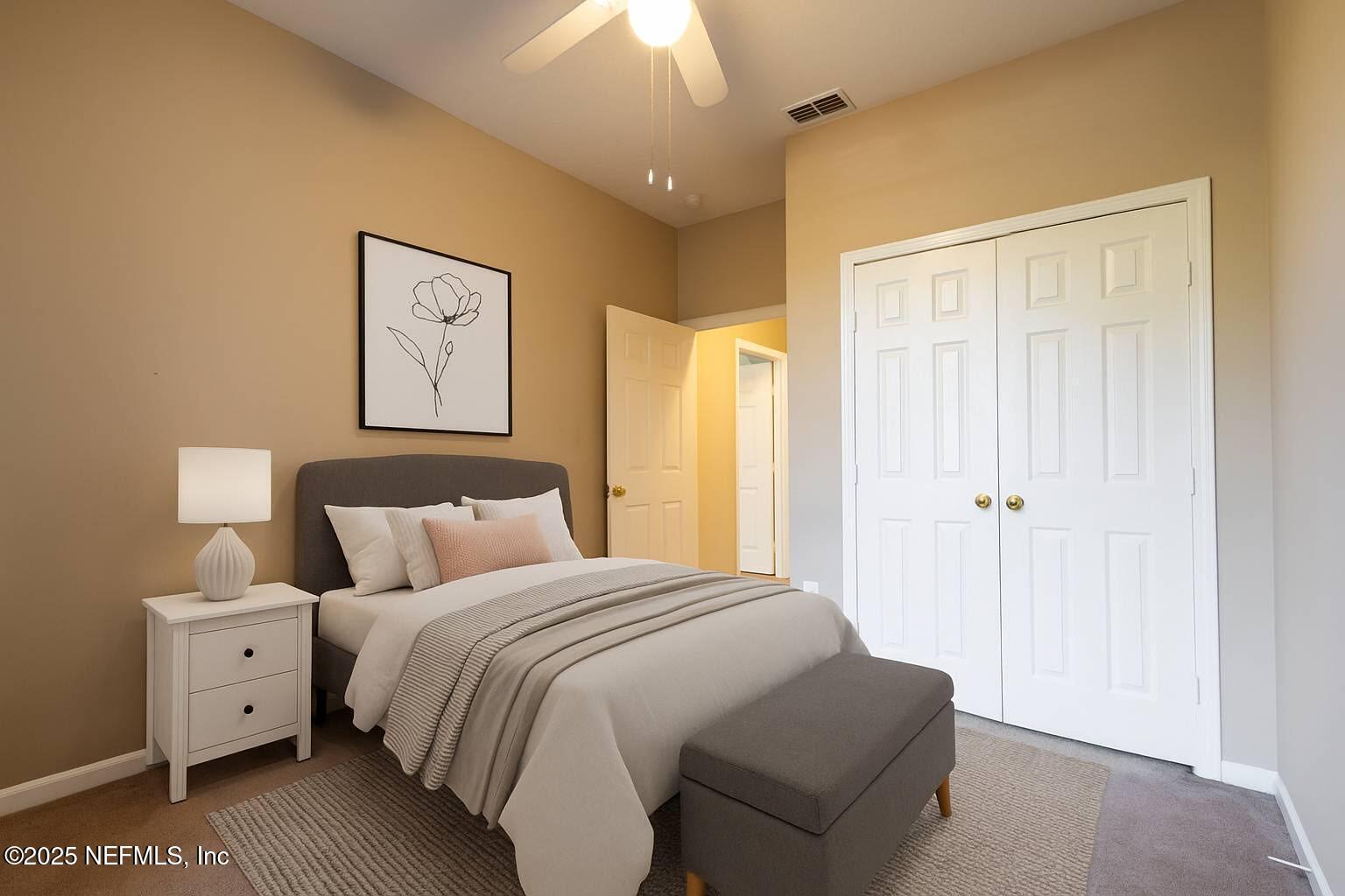 10550 Baymeadows Road, Unit 610 Jacksonville, FL 32256 - Photo 3 of 35 a bedroom with a bed and a chandelier