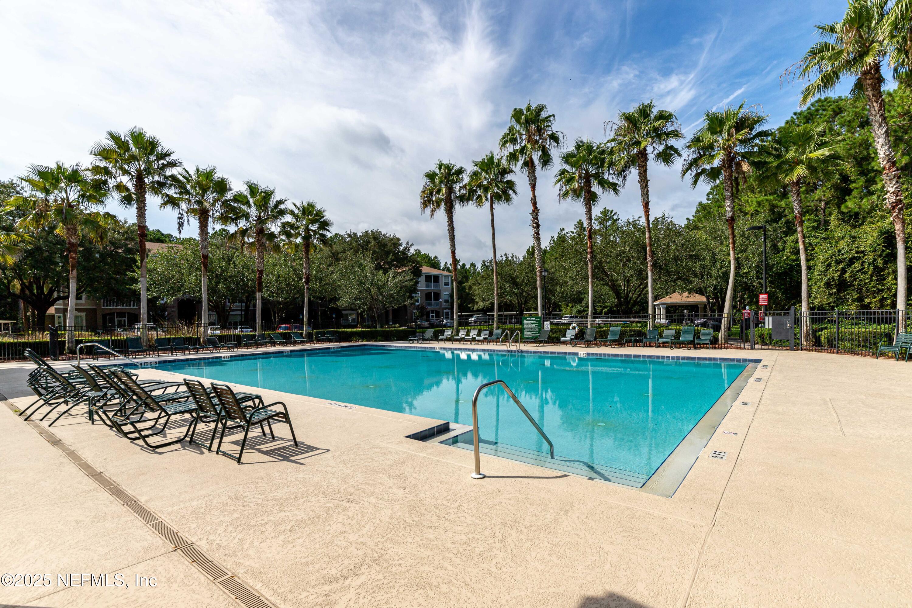 10550 Baymeadows Road, Unit 610 Jacksonville, FL 32256 - Photo 31 of 35 a view of a swimming pool with a patio