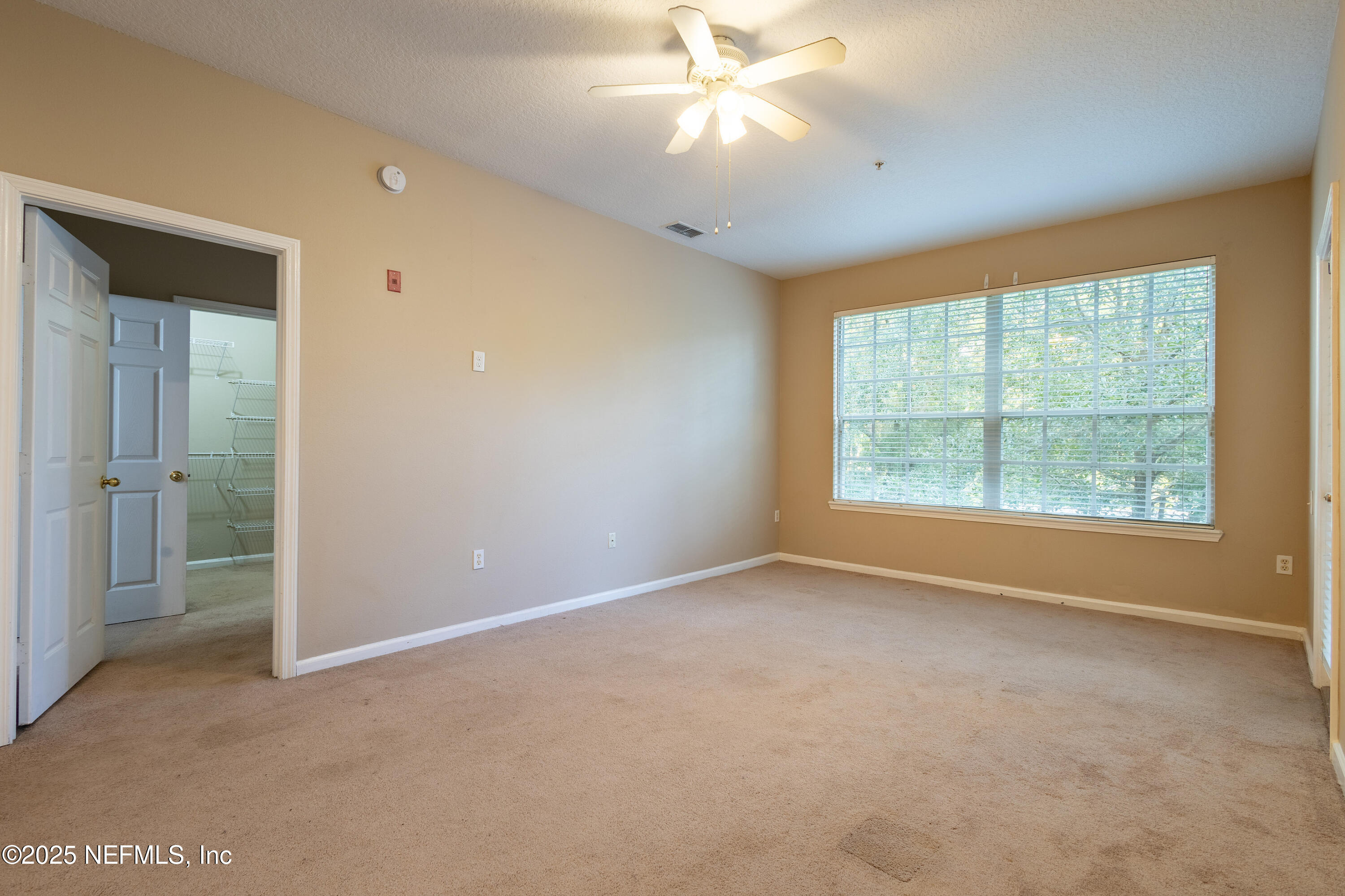 10550 Baymeadows Road, Unit 610 Jacksonville, FL 32256 - Photo 9 of 35 an empty room with windows and closet