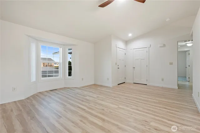 a view of an empty room with a window