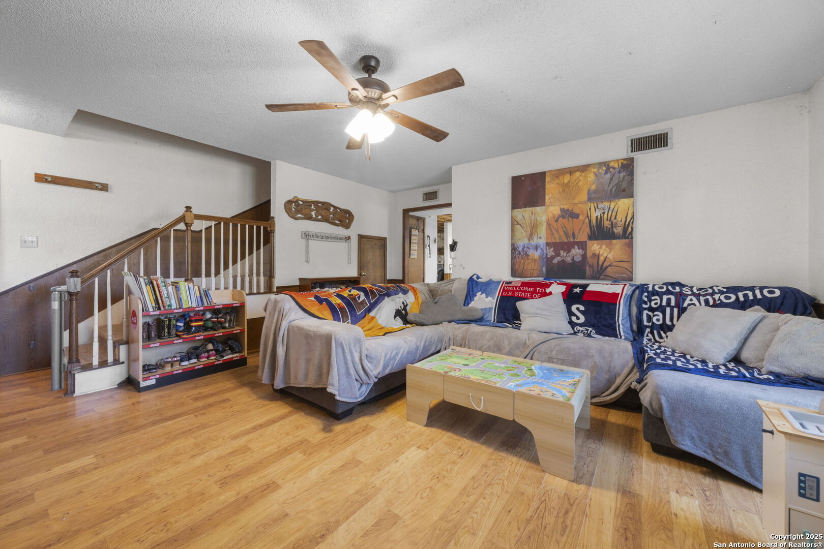 2452 2nd Street Pleasanton, TX 78064 - Photo 11 of 15 a living room with furniture and wooden floor