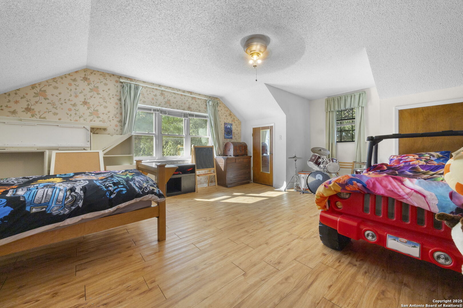 2452 2nd Street Pleasanton, TX 78064 - Photo 13 of 15 a bedroom with a bed and wooden floor