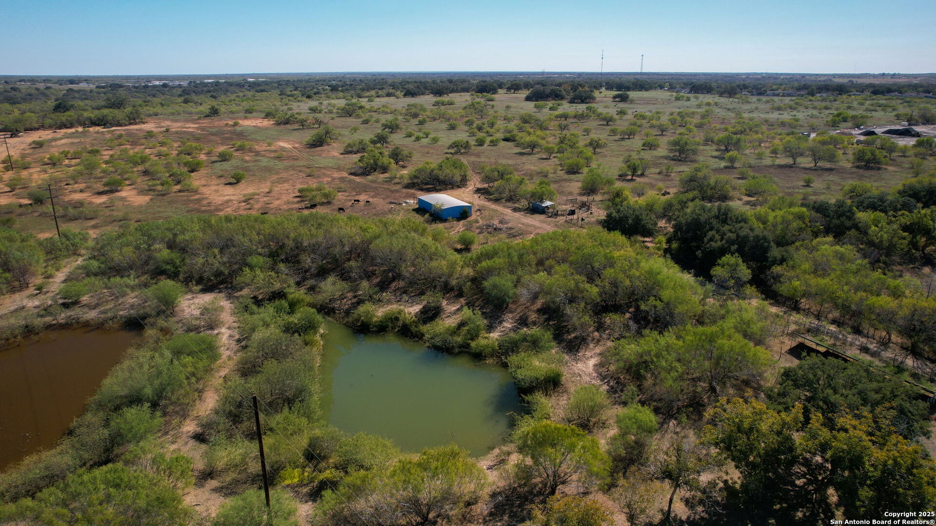 2452 2nd Street Pleasanton, TX 78064 - Photo 4 of 15 an aerial view of residential houses with outdoor space and trees