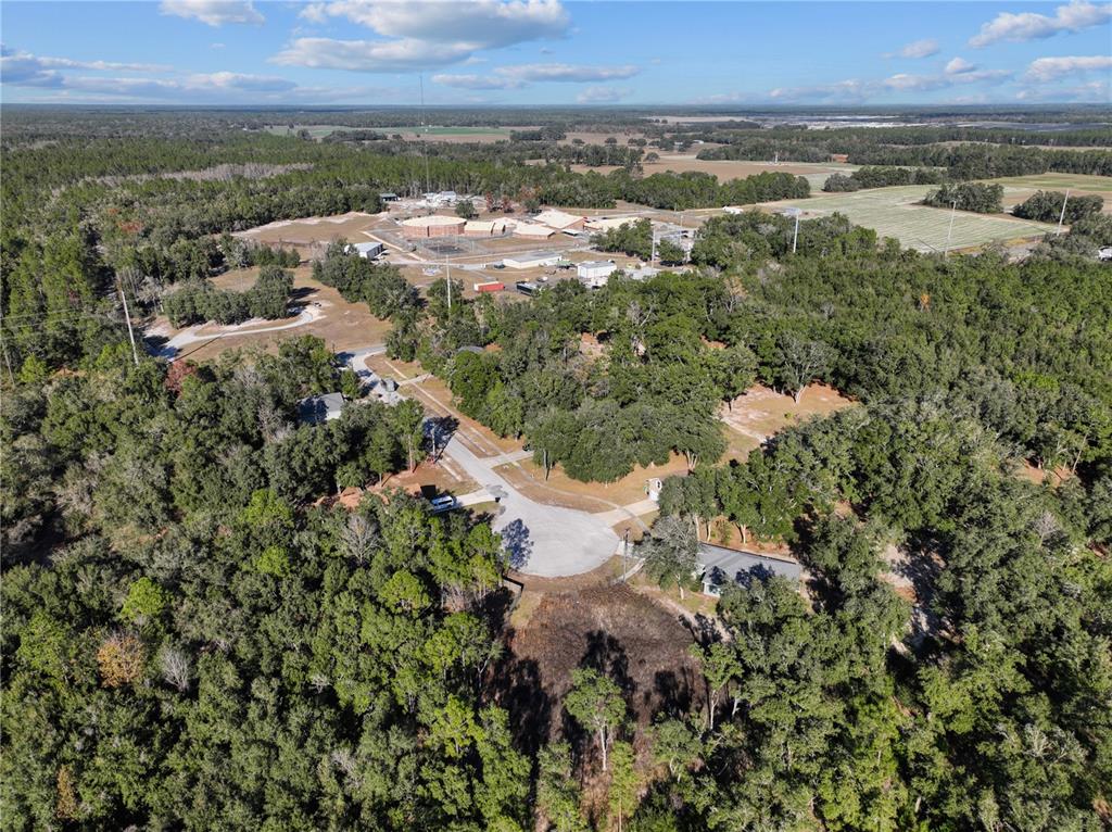 Undisclosed Address Bronson, FL 32621 - Photo 11 of 11 an aerial view of residential houses with outdoor space