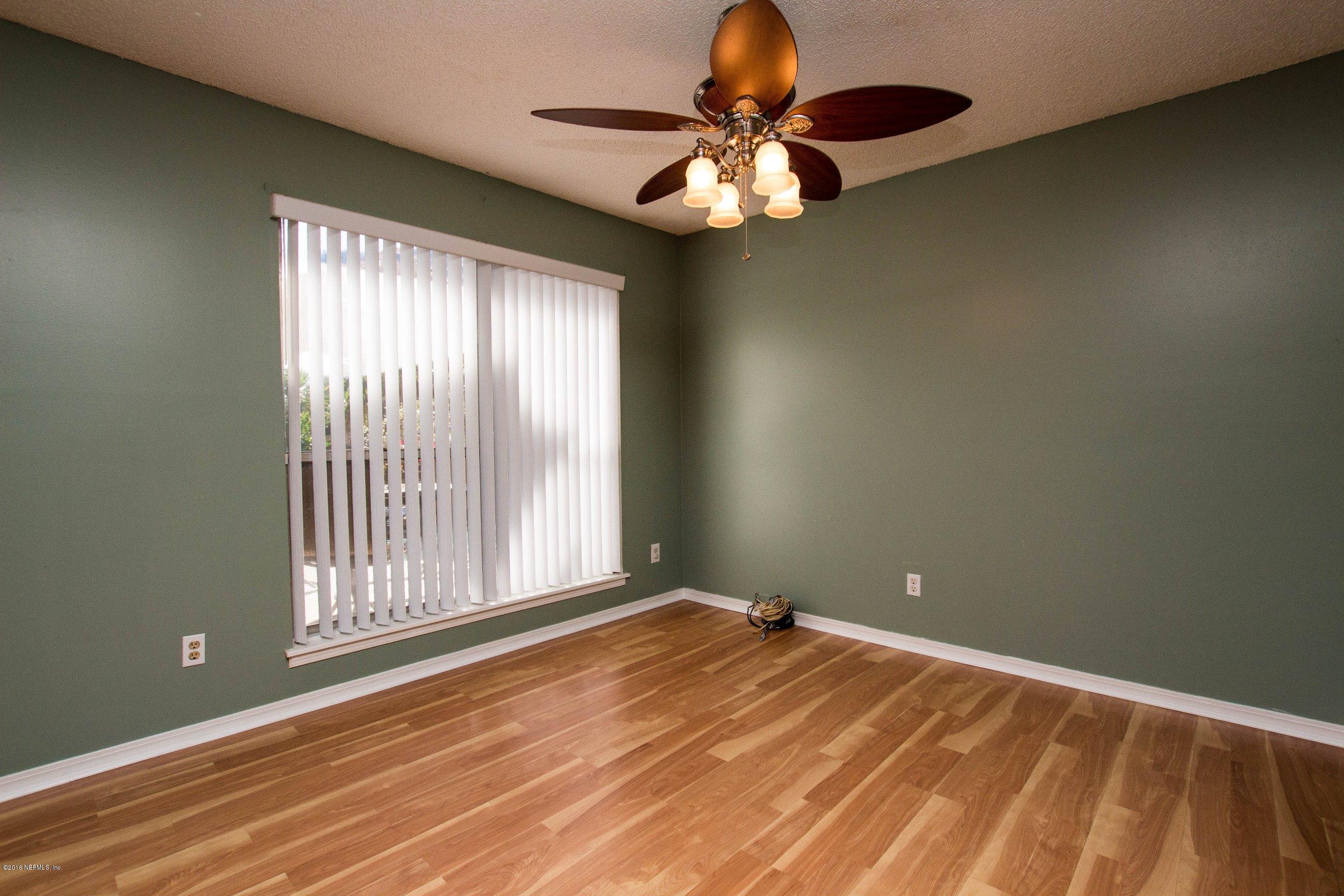 1609 Derringer Road Jacksonville, FL 32225 - Photo 15 of 33 a view of a livingroom with an empty space and a window