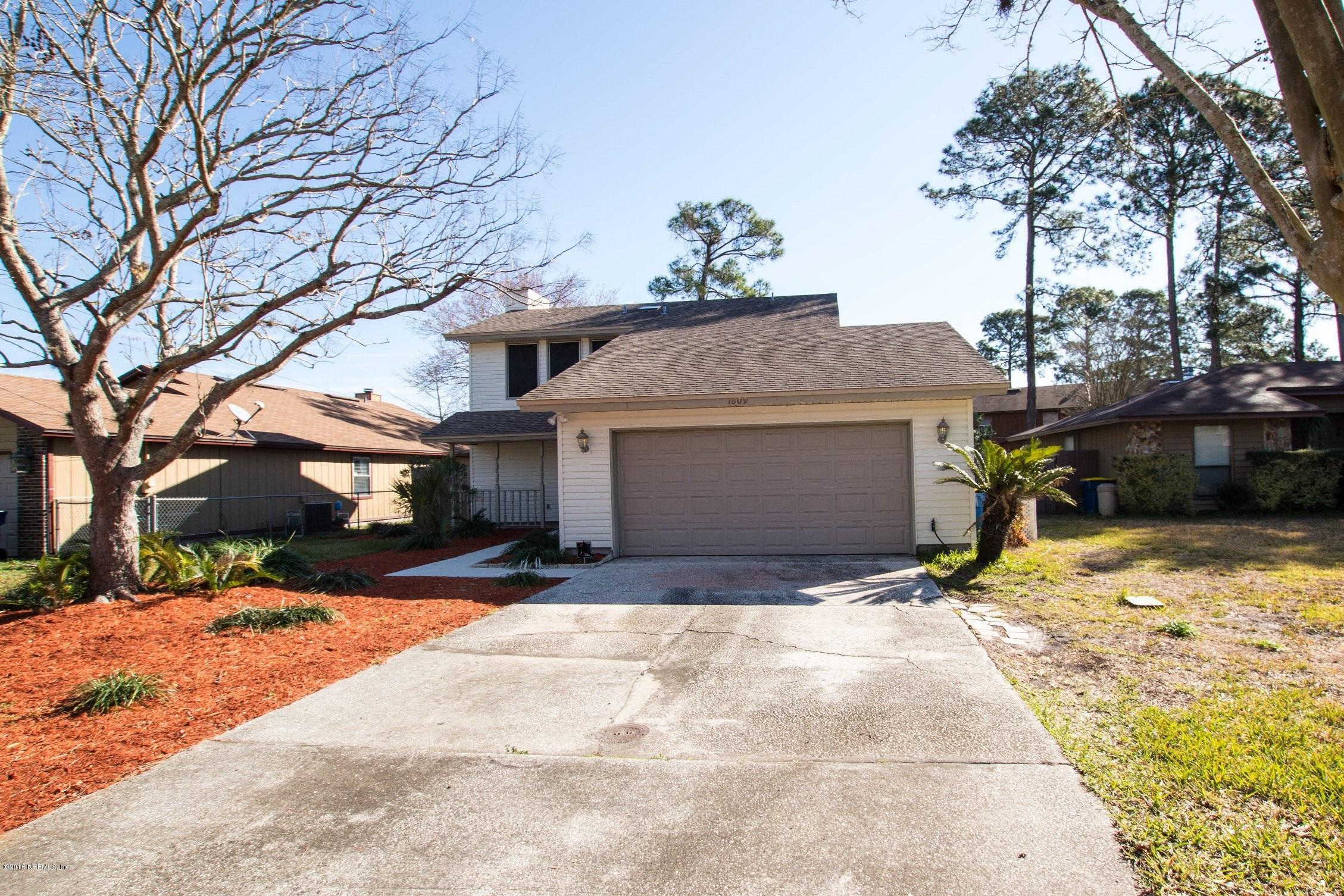 1609 Derringer Road Jacksonville, FL 32225 - Photo 33 of 33 a view of a house with snow in the yard