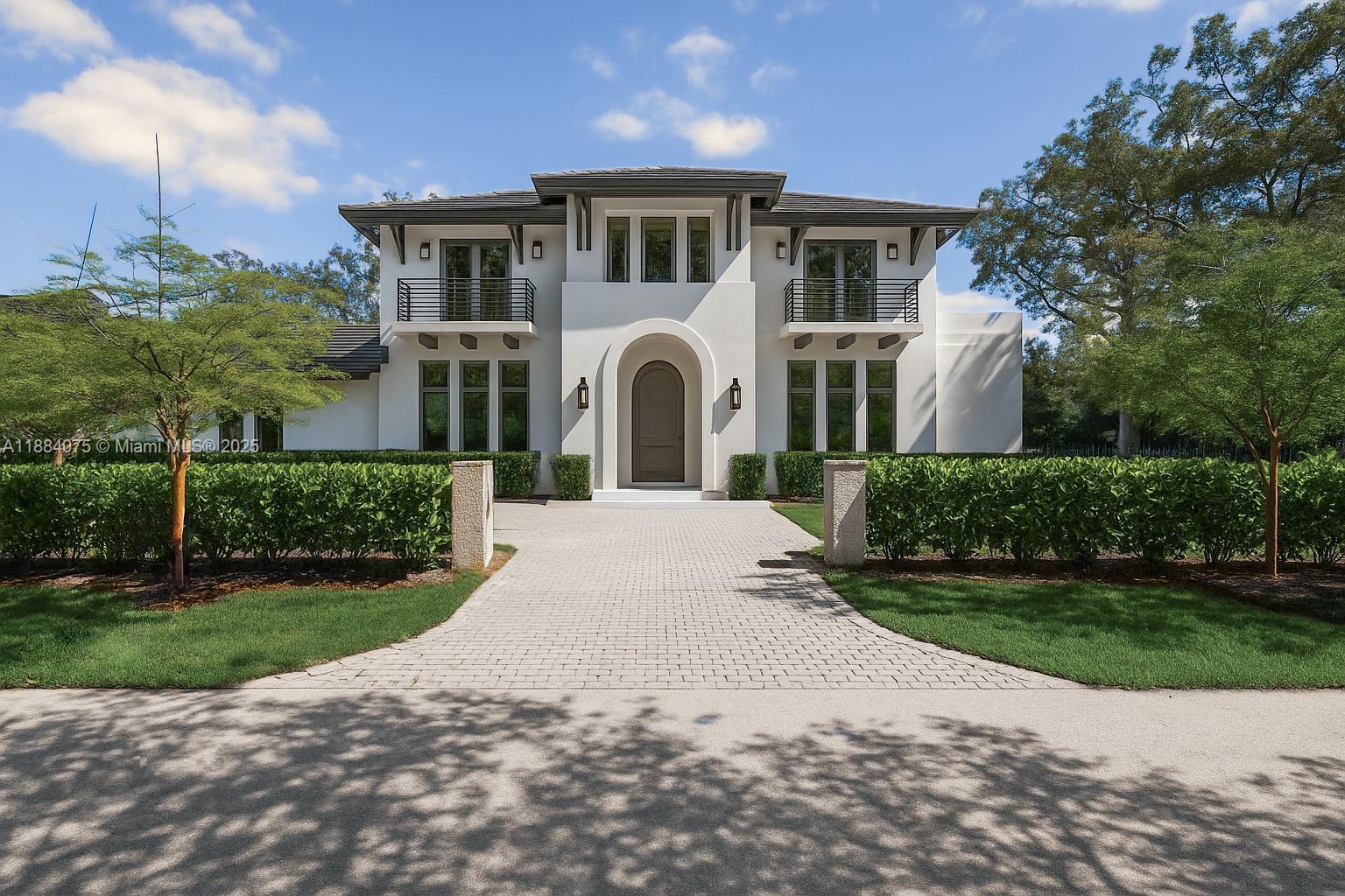 a front view of a house with a garden