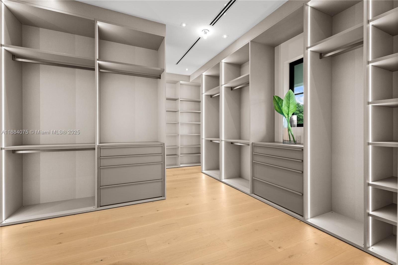 7001 Southwest 71st Avenue Miami, FL 33143 - Photo 11 of 50 a view of walk in closet with empty racks