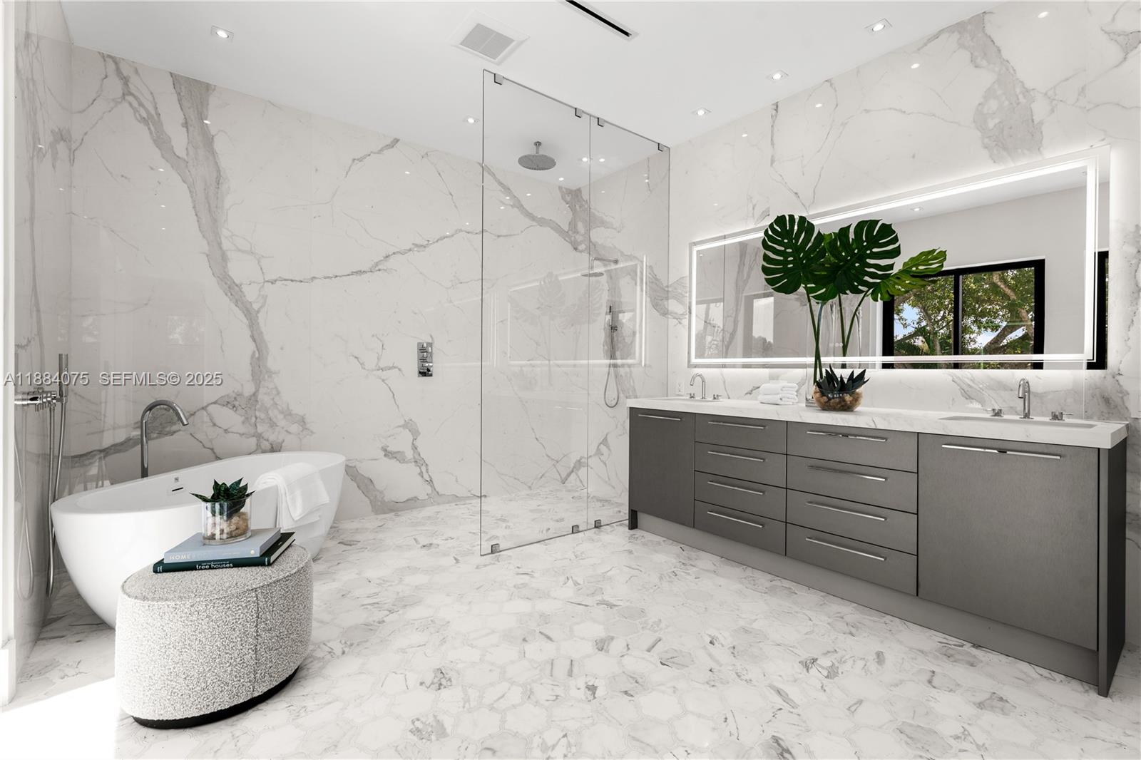 7001 Southwest 71st Avenue Miami, FL 33143 - Photo 12 of 50 a bathroom with a tub sink and mirror