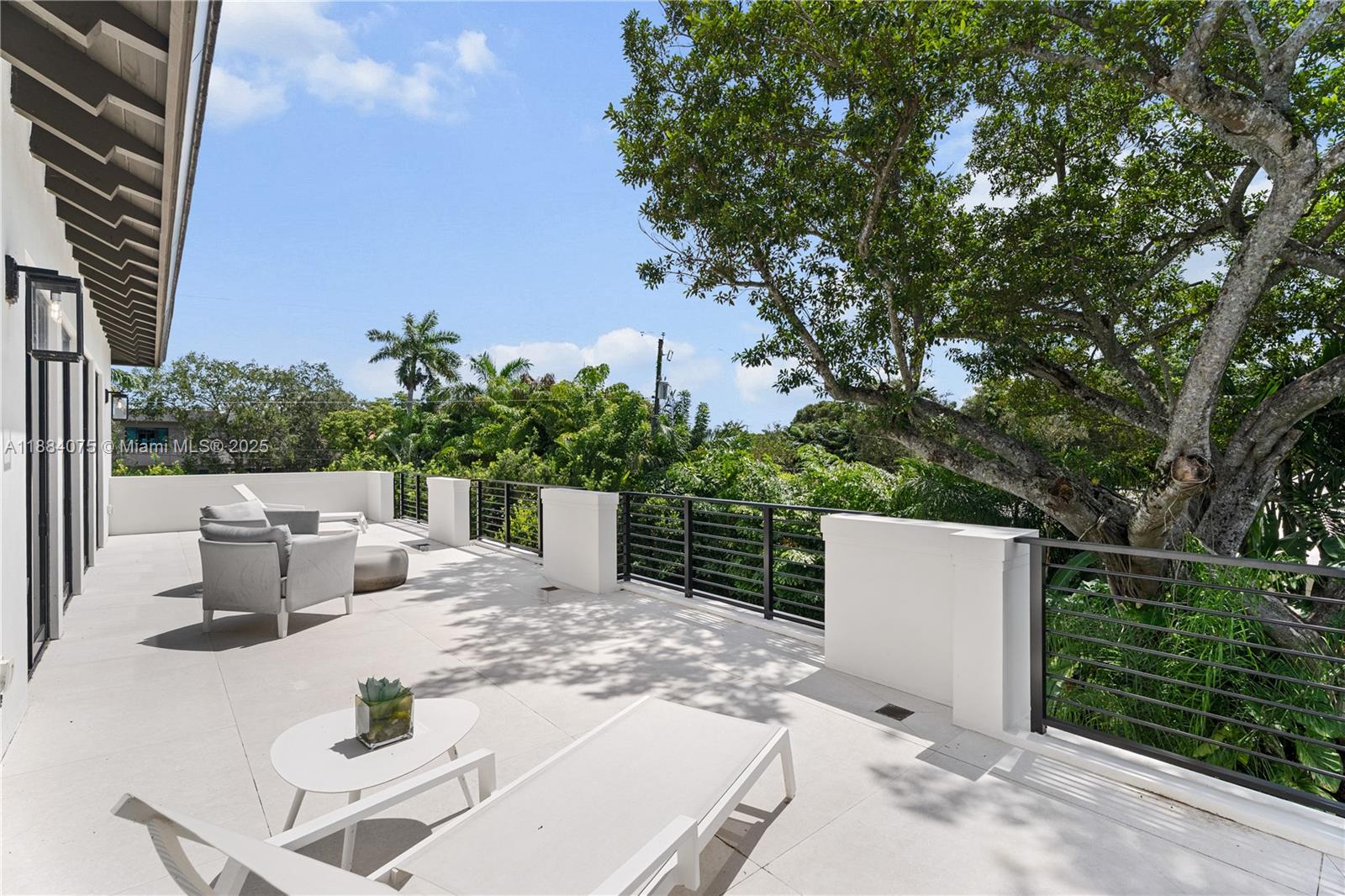 7001 Southwest 71st Avenue Miami, FL 33143 - Photo 14 of 50 a view of backyard of house with seating space