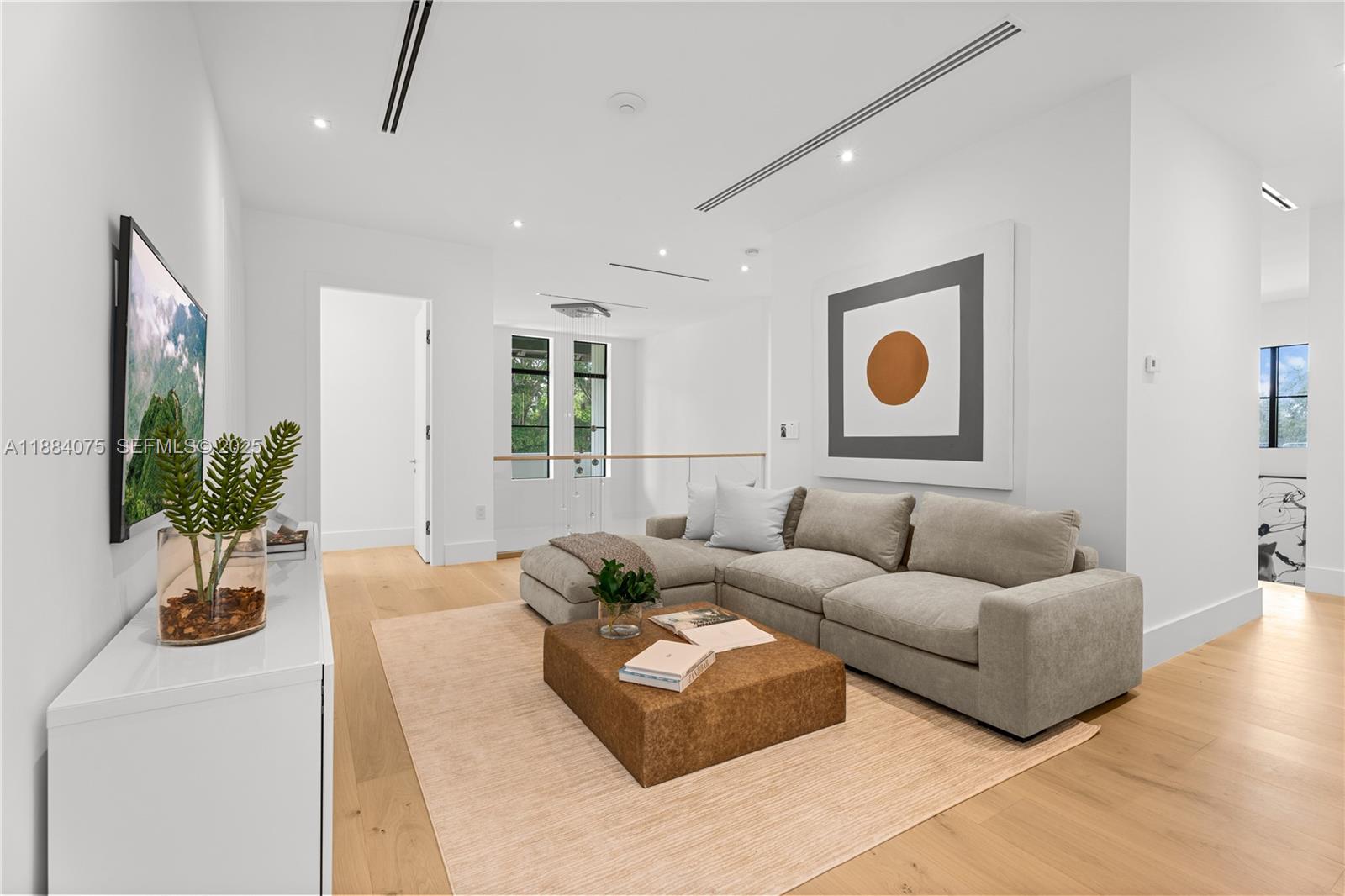 7001 Southwest 71st Avenue Miami, FL 33143 - Photo 15 of 50 a living room with furniture and a potted plant
