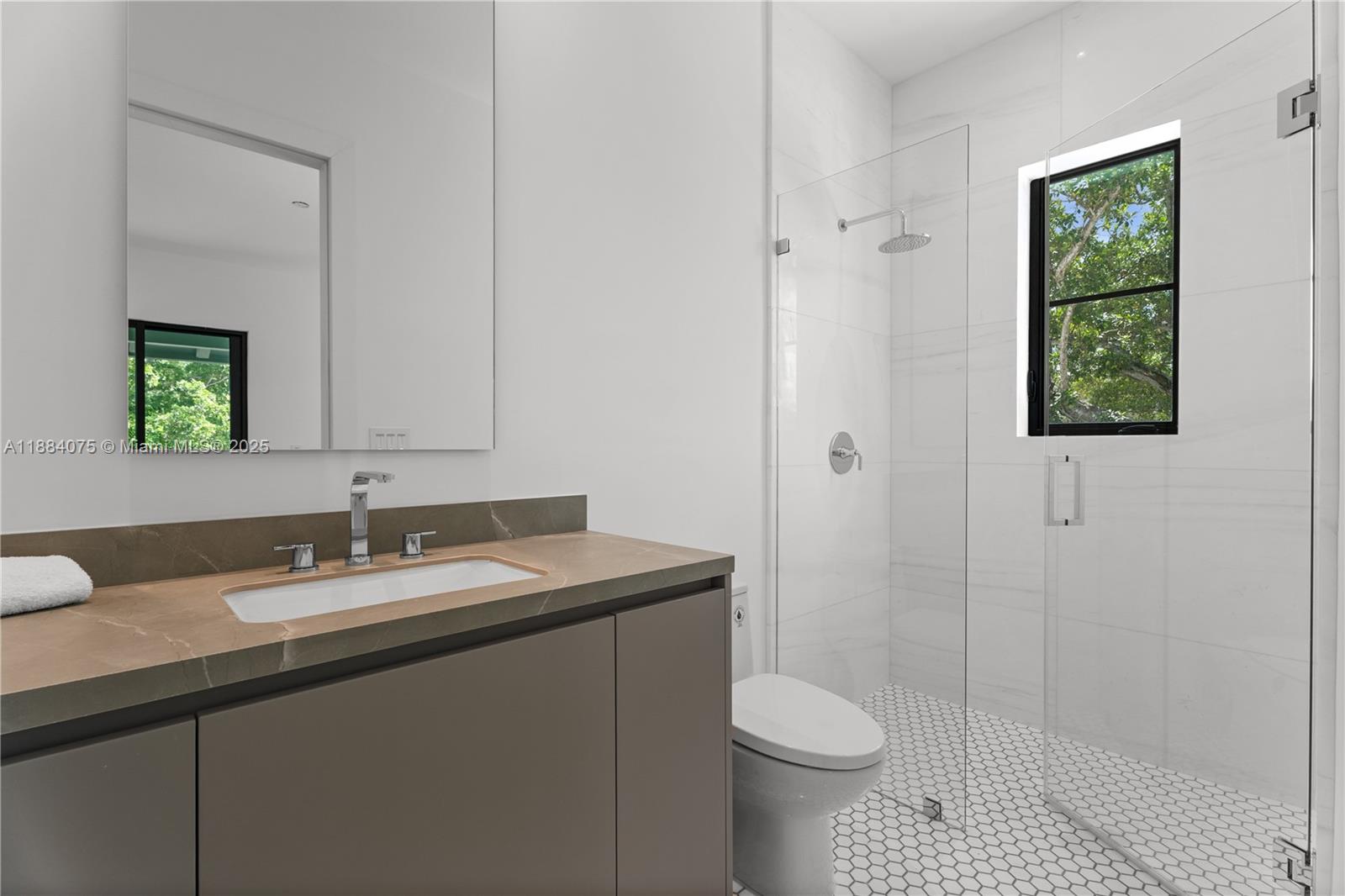 7001 Southwest 71st Avenue Miami, FL 33143 - Photo 19 of 50 a bathroom with a sink toilet and shower