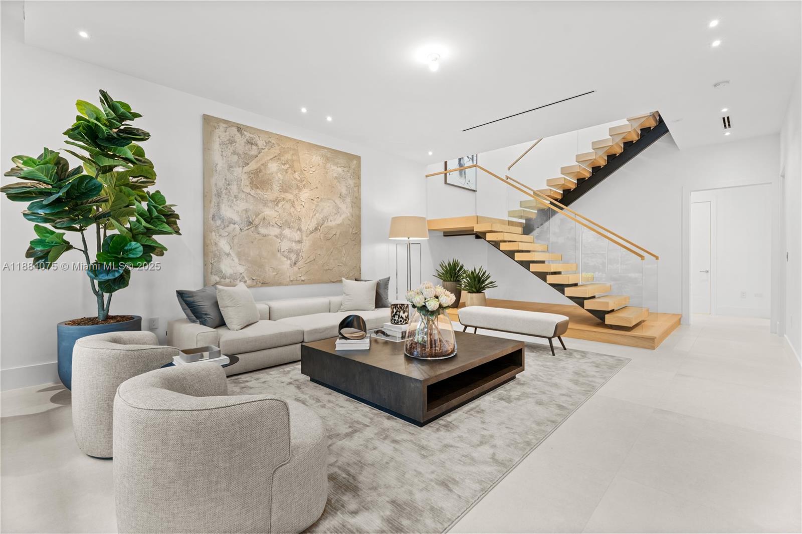 7001 Southwest 71st Avenue Miami, FL 33143 - Photo 2 of 50 a living room with furniture and flowers