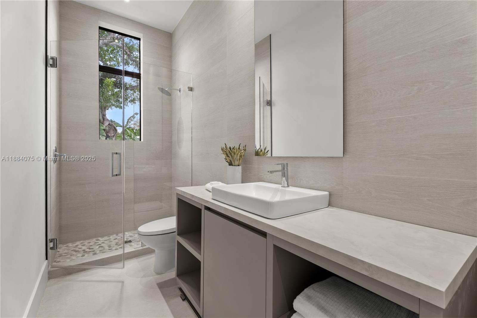 7001 Southwest 71st Avenue Miami, FL 33143 - Photo 25 of 50 a bathroom with a sink a toilet and shower