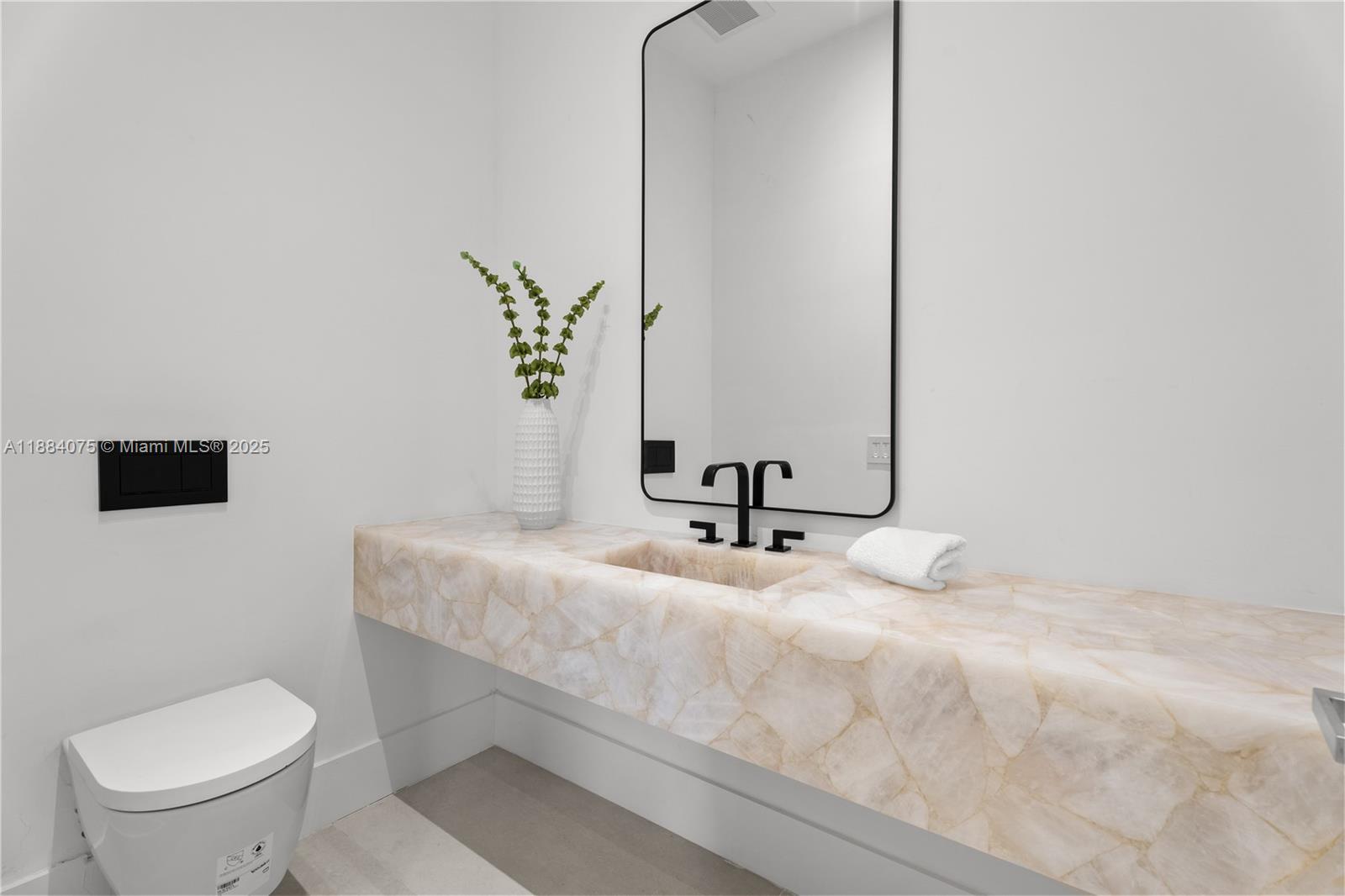 7001 Southwest 71st Avenue Miami, FL 33143 - Photo 27 of 50 a bathroom with a toilet sink and mirror