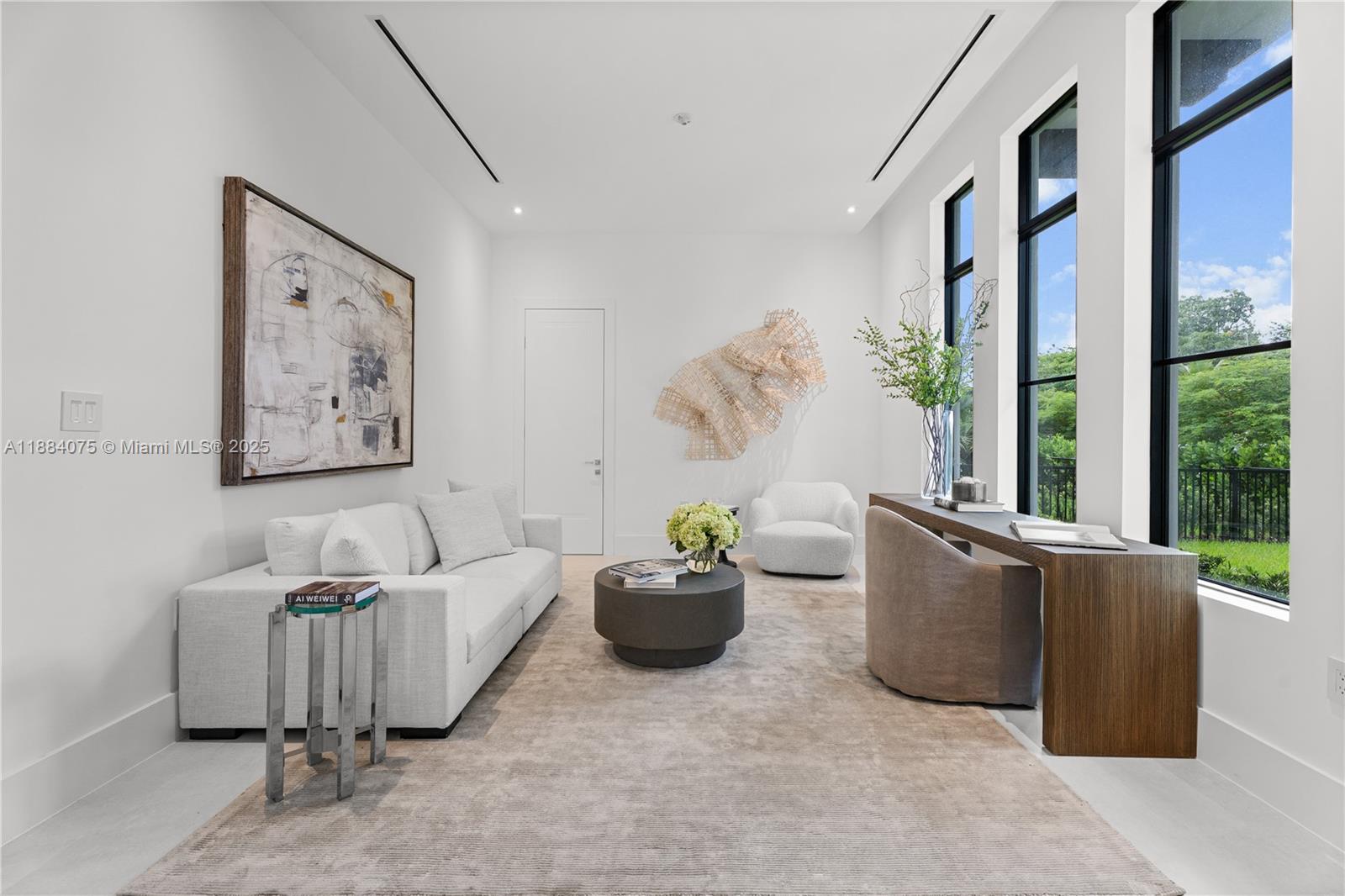 7001 Southwest 71st Avenue Miami, FL 33143 - Photo 29 of 50 a living room with furniture and a large window