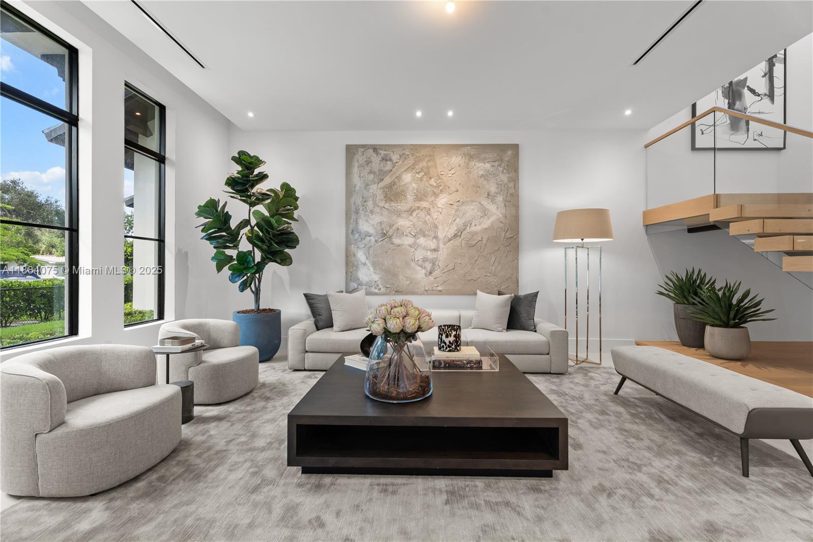 7001 Southwest 71st Avenue Miami, FL 33143 - Photo 30 of 50 a living room with furniture potted plant and a large window
