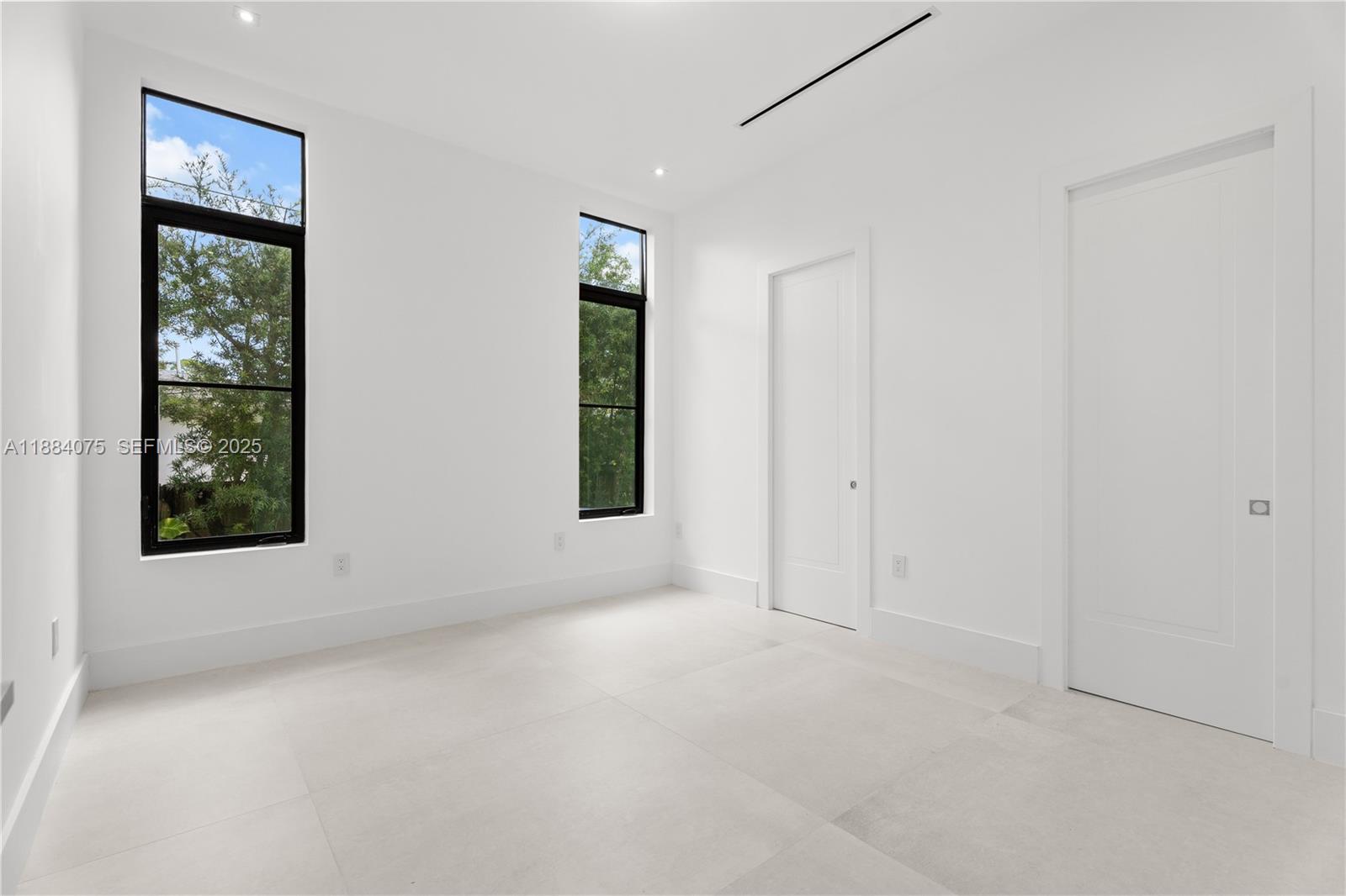 7001 Southwest 71st Avenue Miami, FL 33143 - Photo 39 of 50 an empty room with windows and closet