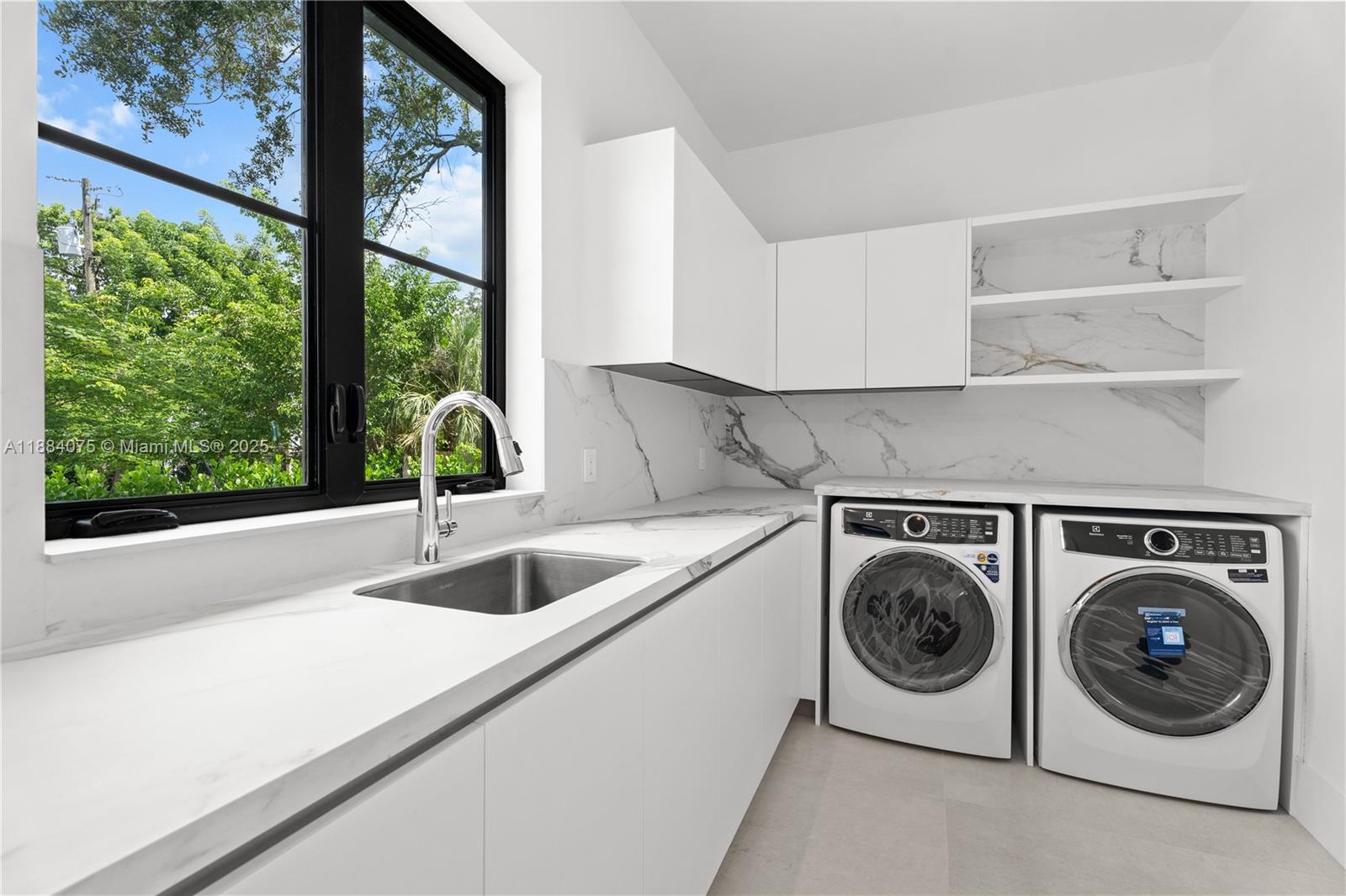 7001 Southwest 71st Avenue Miami, FL 33143 - Photo 40 of 50 a utility room with sink dryer and washer