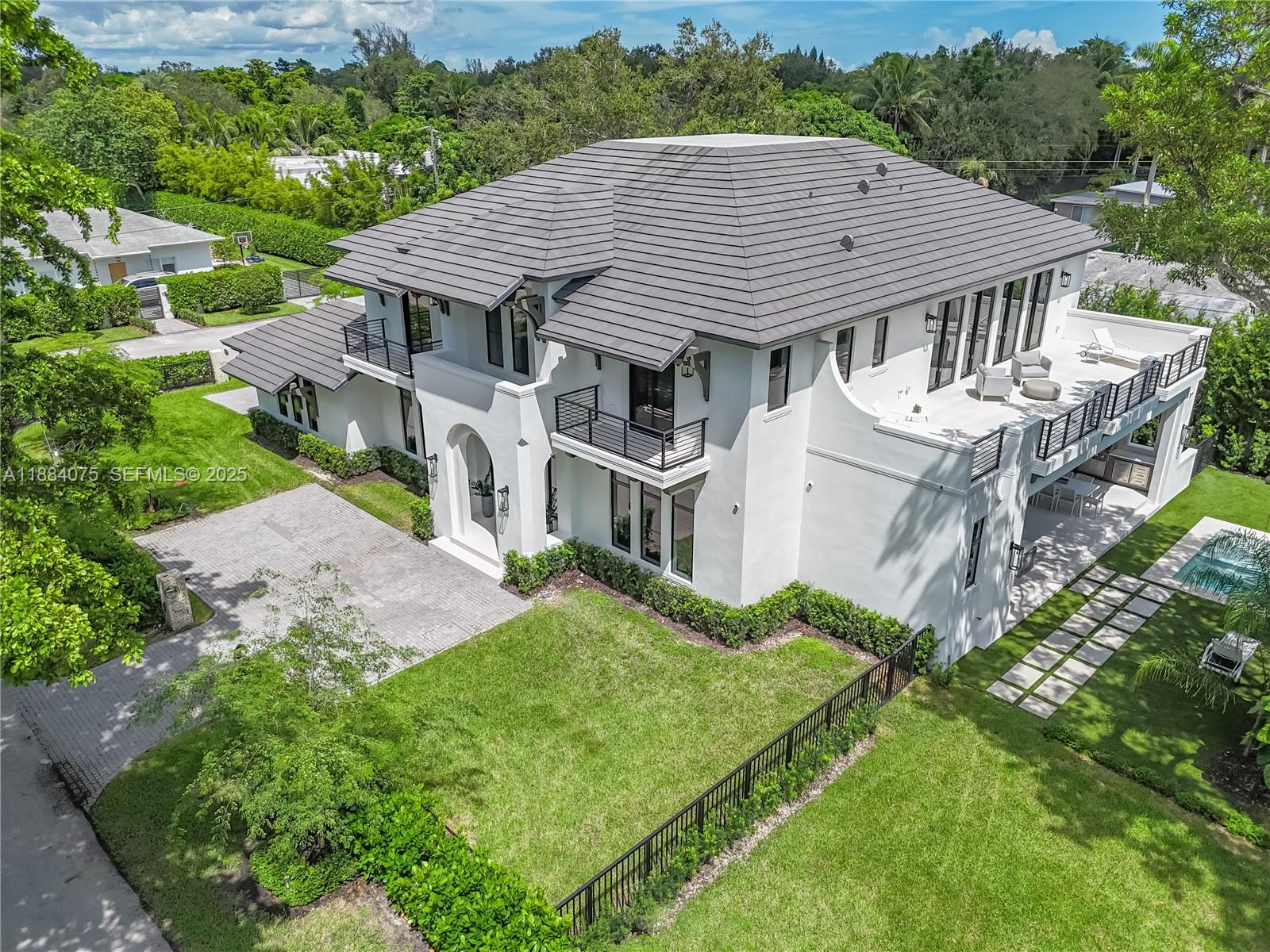 7001 Southwest 71st Avenue Miami, FL 33143 - Photo 46 of 50 aerial view of a house with a yard table and chairs