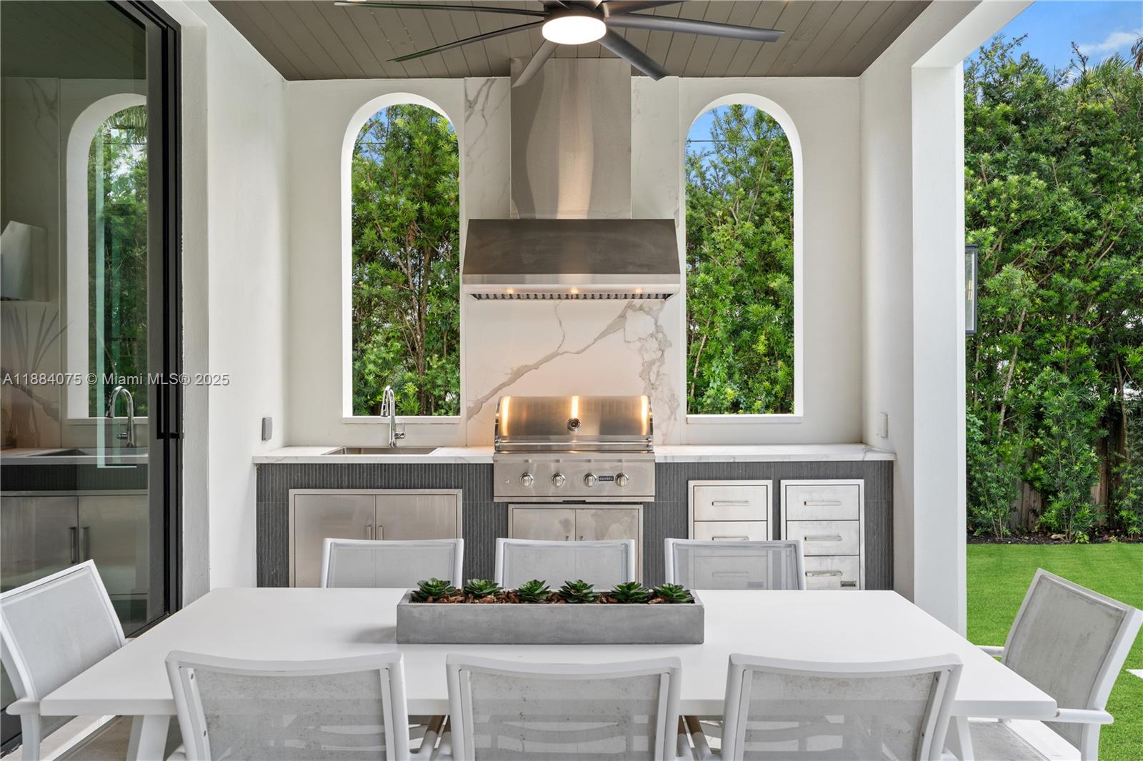 7001 Southwest 71st Avenue Miami, FL 33143 - Photo 8 of 50 a front view of a house with garden