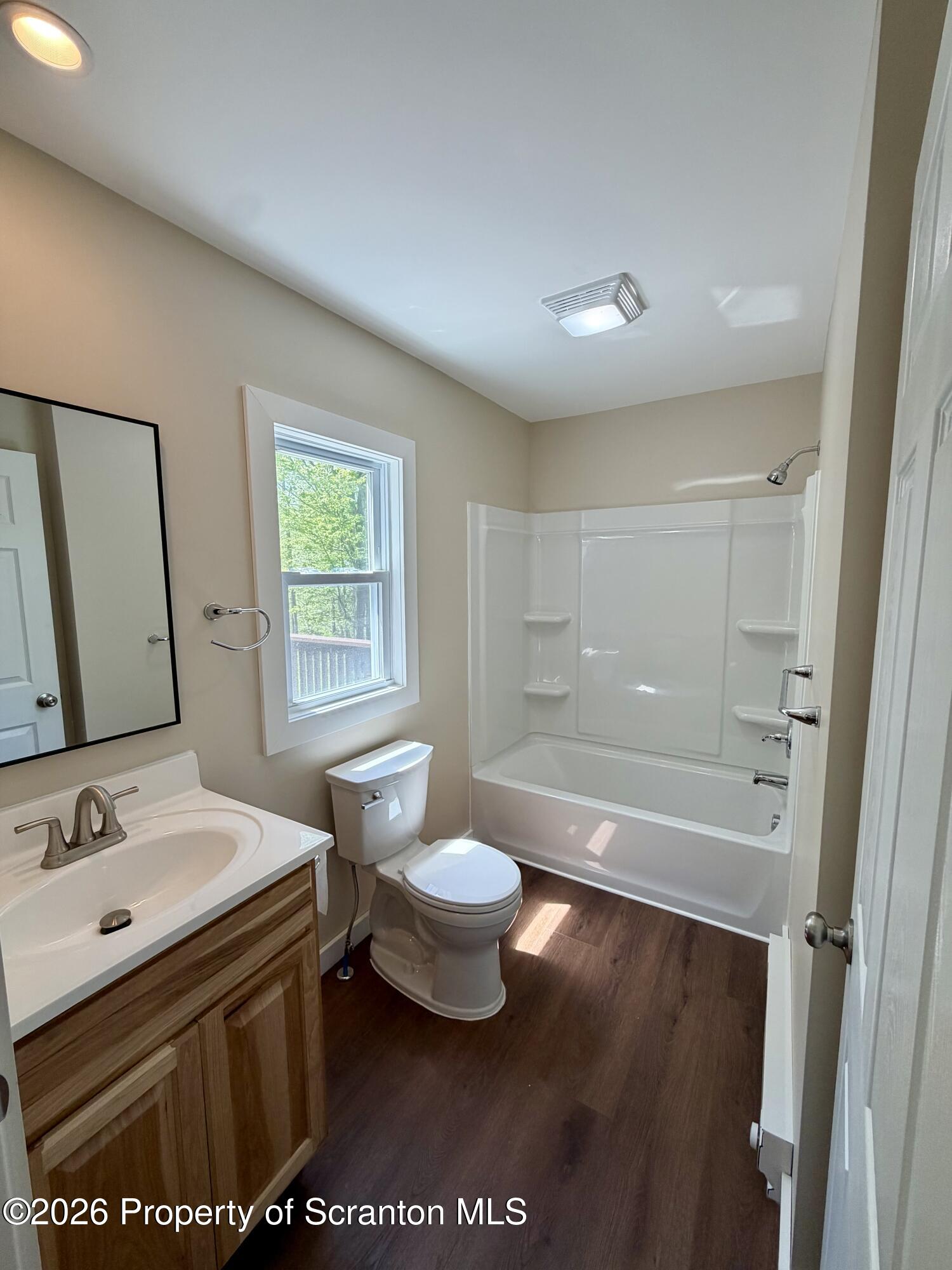 2139 Fawn Path Gouldsboro, PA 18424 - Photo 9 of 9 a bathroom with a sink a toilet a mirror and bathtub