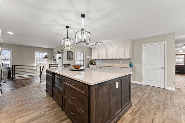 a view of a chairs and table in the balcony