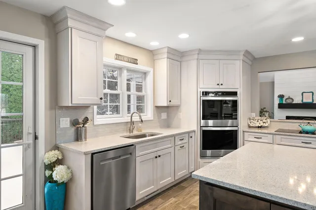 a view of the house with snow on the background