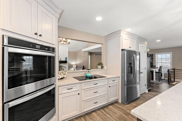 a view of a patio with table and chairs