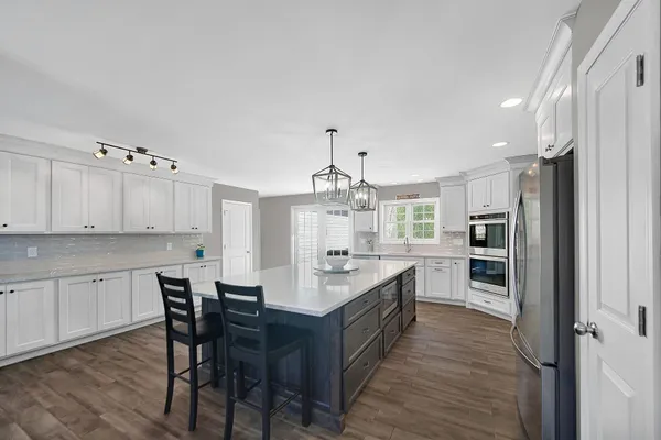 a bedroom with a bed and a fireplace