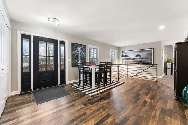 a living room with furniture and white walls