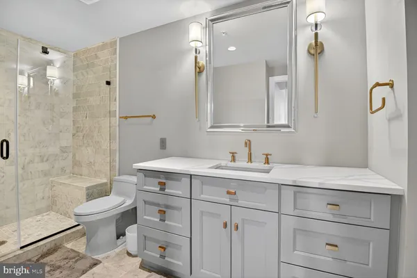 a bathroom with a toilet sink and shower