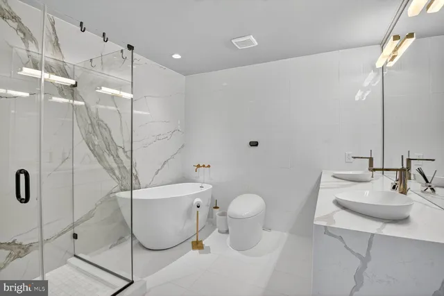 a bedroom with a bed and a desk