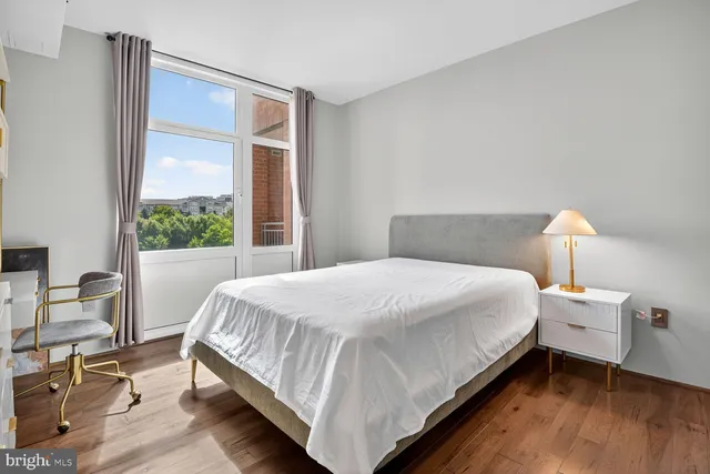 a bedroom with a bed and cabinets