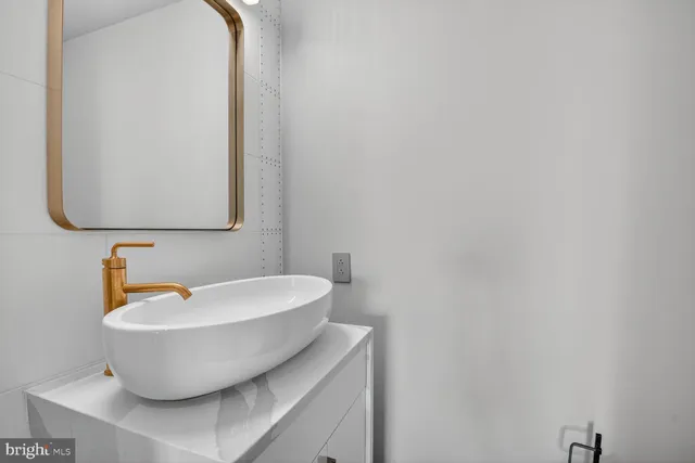 a close view of a utility room with dryer and washer
