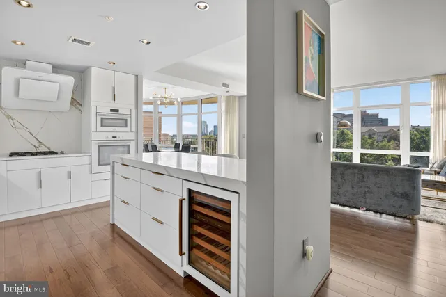 a kitchen with granite countertop a stove and a refrigerator