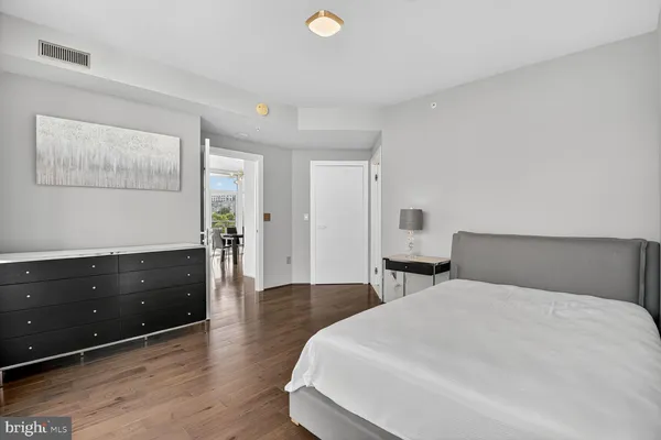 a bedroom with a bed and a desk