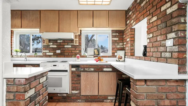 a kitchen with a sink and cabinets
