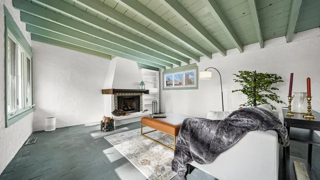 a living room with furniture and a fireplace