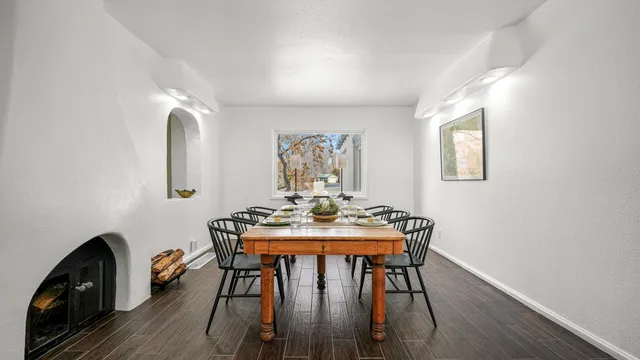 a view of a workspace with furniture and wooden floor