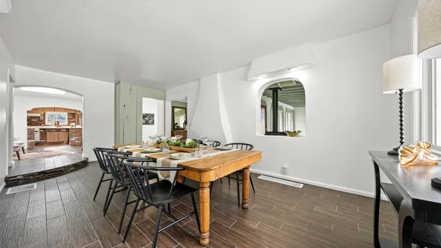 a view of a dining room with furniture and wooden floor
