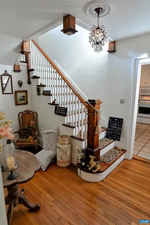 a view of entryway livingroom and hall with wooden floor